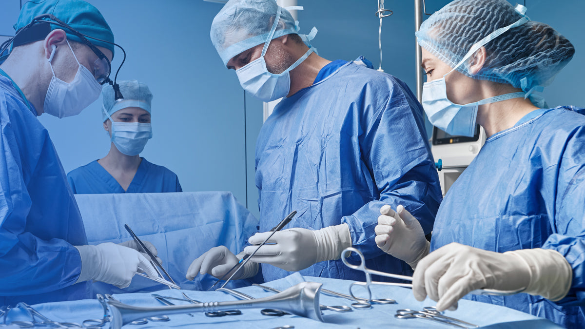 Surgical team in an operating room demonstrating the importance of medical supplies and surgical instruments in patient care.